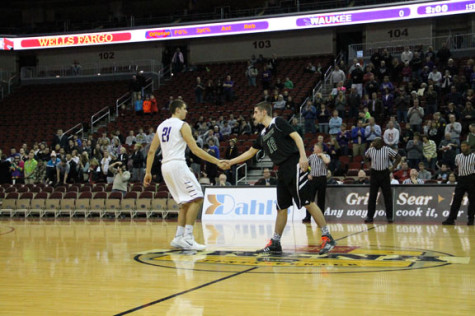 Sophomore Ben Hayes shakes hands with his match up before the game.