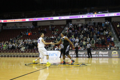 Senior Sam Williams Jr shakes hands with his match up before the game.