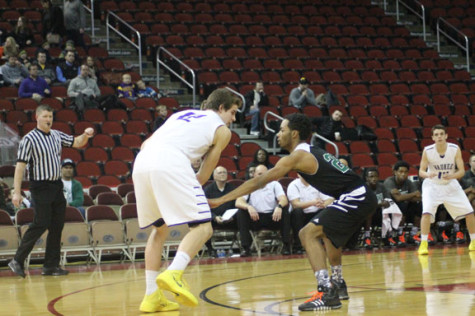 Junior Neico Greene guards a Waukee player.