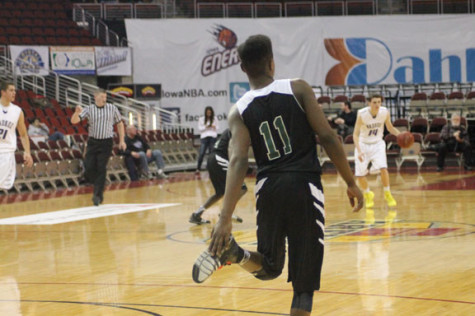 Senior Terrance Bush Jr gets ready to play some defense on the Waukee Warriors.