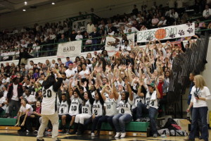 The famous North High student sections does their famous Roller Coaster.