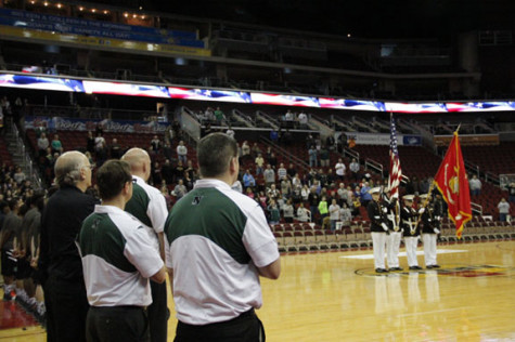 The North High ROTC presents the colors for the national anthem before the game.
