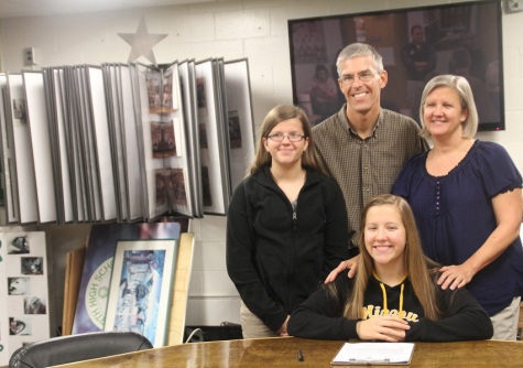 Moriah Ross and her family in the alumni room