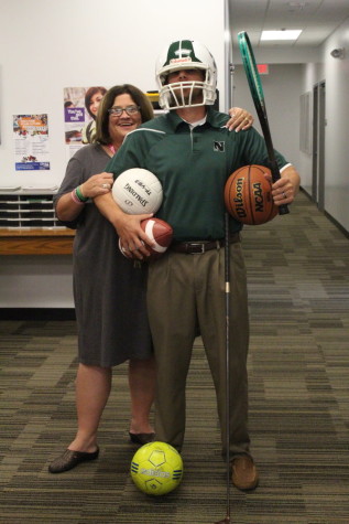 New Athletic Director OJ Sinclair and Athletic Secretary Terri Buban pose showing just some of the sports here at North High.
