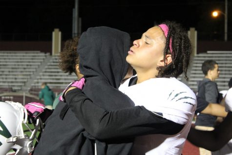 Tre'Vawn Jarrett comforts Jesse Malavong after his injury.