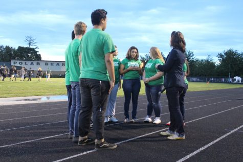 The North High Choir sings "God Bless America" before the game.