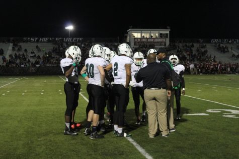 The Polar Bears take a timeout to discuss the next play.