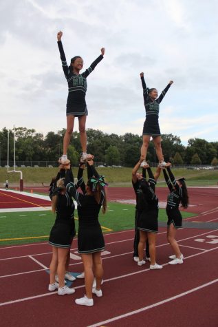 The North High cheerleaders are ready to start the game.